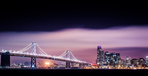 bay-bridge-with-san-francisco-skyscrapers-cityscape-at-night.jpg